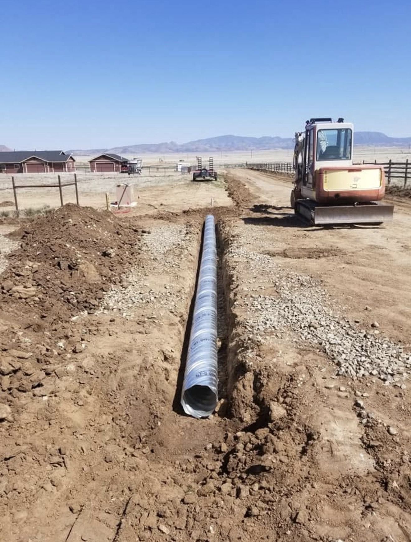 Long corrugated culvert in a freshly dug trench